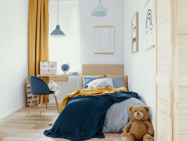 Multifunctional bedroom and workspace interior with bed and desk